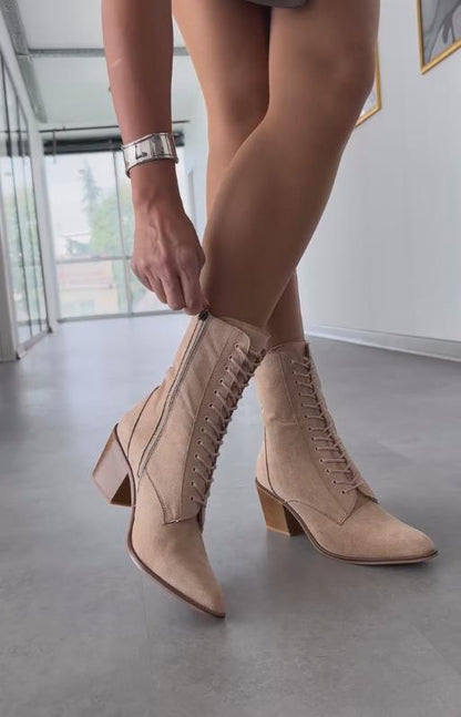 Light brown suede mid-calf lace-up boots